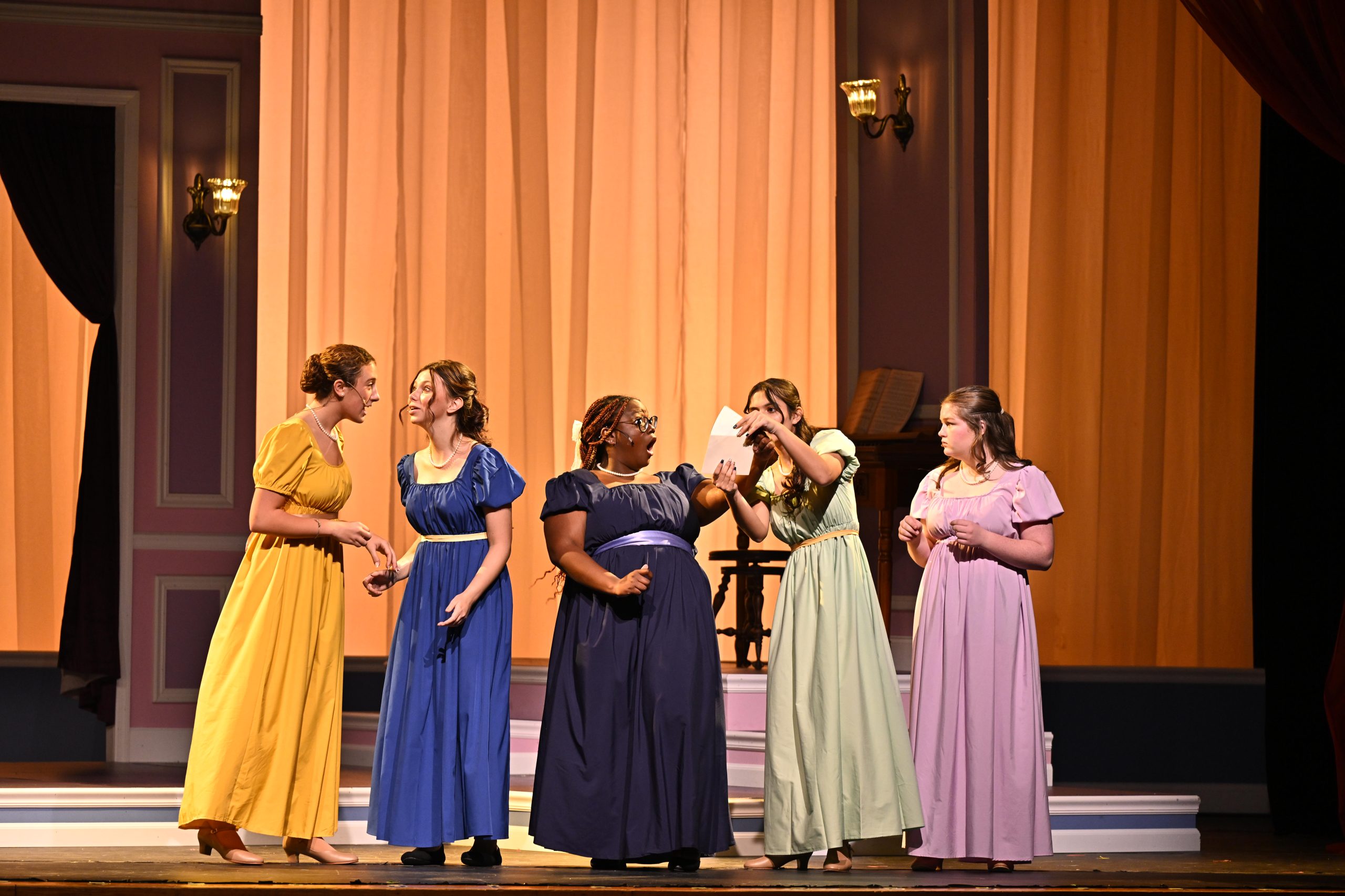 students performing on stage